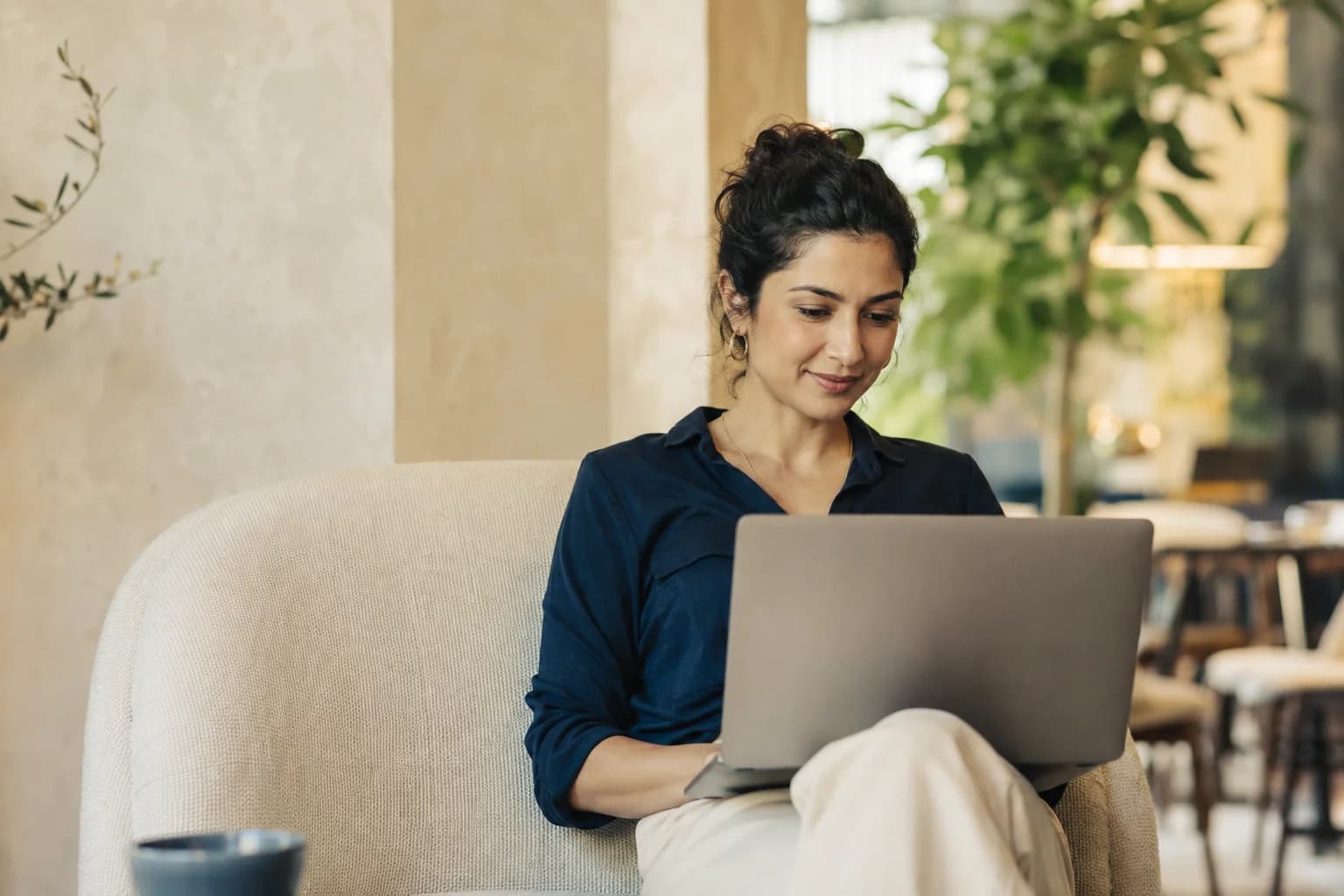 A client reviewing their live application tracker on a laptop